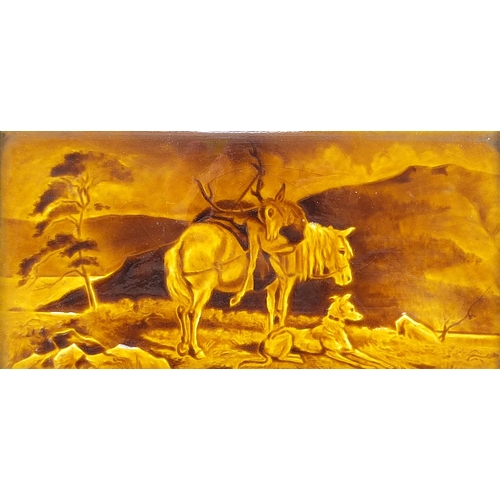 47 - Large Victorian treacle glazed tile hand painted a pony, deer and dog in a landscape, framed, the ti... 