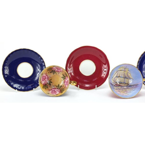 90 - Three Aynsley cups and saucers including two hand painted with flowers and one decorated with a rigg... 