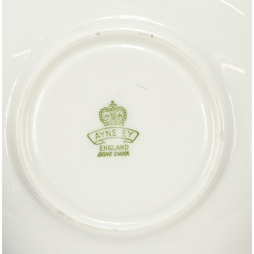 90 - Three Aynsley cups and saucers including two hand painted with flowers and one decorated with a rigg... 