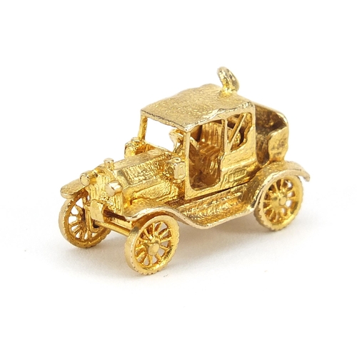 862 - 9ct gold classic car opening charm, 2.5cm in length, 7.6g