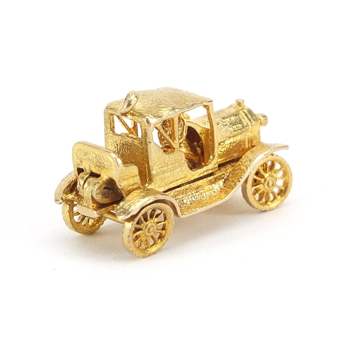 862 - 9ct gold classic car opening charm, 2.5cm in length, 7.6g