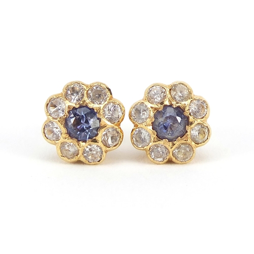 875 - Pair of 9ct gold purple and clear stone flower head earrings, 1.0cm in diameter, 3.1g