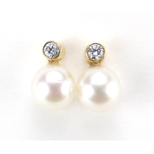 859 - Pair of 18ct gold pearl and diamond stud earrings, 1.3cm high, 3.4g