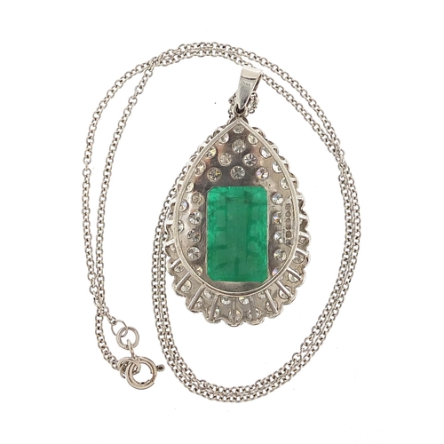 857 - 18ct white gold diamond and emerald pendant on an 18ct white gold necklace, each diamond approximate... 