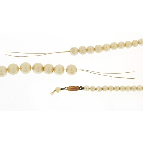 2181 - Graduated simulated pearl necklace with 9ct gold clasp, 56cm in length, 18.3g