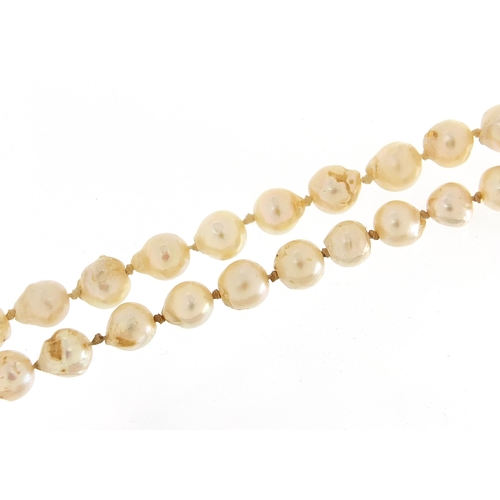 2191 - Nitto pearl necklace with silver clasp and embroidered case, 90cm in length, 51.0g