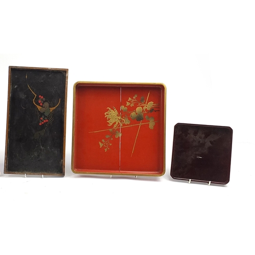 140 - Five Japanese lacquered trays hand painted with animals and flowers including a red example with sea... 