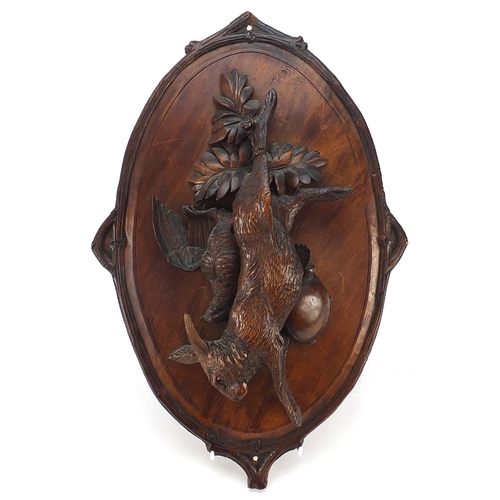 22 - 19th century German Black Forest hunting trophy plaque carved in relief with hanging game and birds,... 