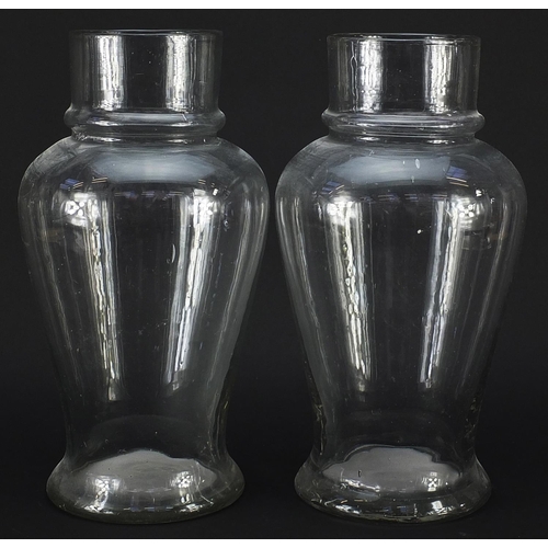 152 - Pair of 19th century apothecary baluster glass vases, each 32.5cm high