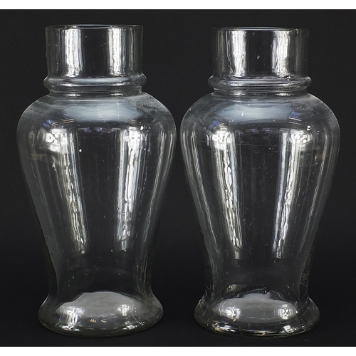 152 - Pair of 19th century apothecary baluster glass vases, each 32.5cm high