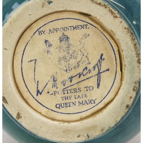 92 - Moorcroft Pottery baluster vase hand painted with two flowers, paper label to the base, 10cm high