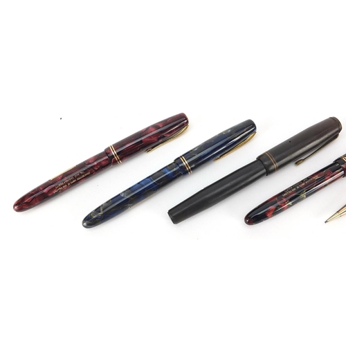 67 - Vintage fountain pens and propelling pencils including three marbleised Burnham fountain pens with g... 