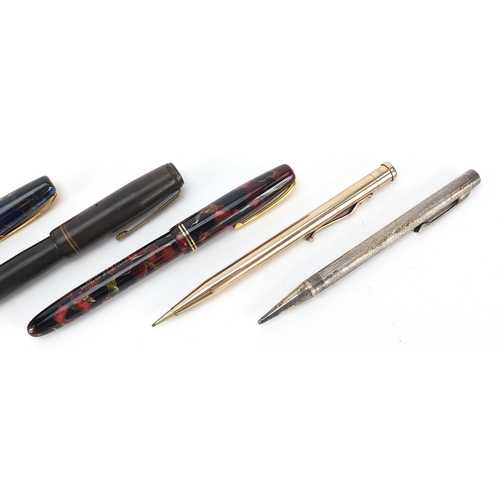 67 - Vintage fountain pens and propelling pencils including three marbleised Burnham fountain pens with g... 