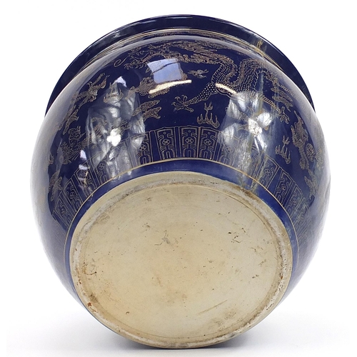 82 - Chinese cobalt blue ground jardiniere gilded with dragons chasing a flaming pearl amongst clouds, 32... 