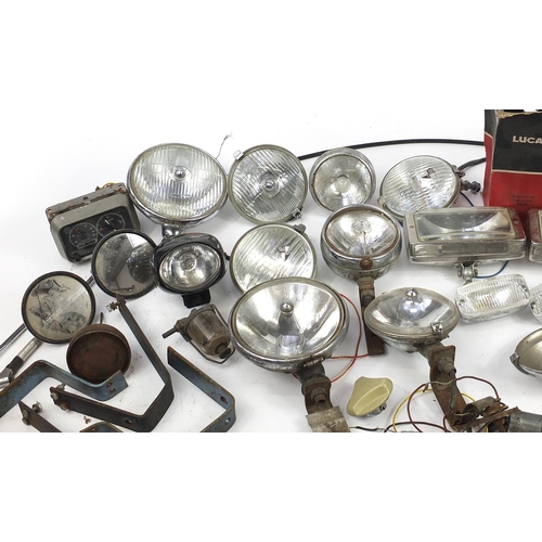 115 - Large collection of vintage motoring interest vehicle parts including Lucas lamps and Marchal headli... 