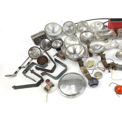 115 - Large collection of vintage motoring interest vehicle parts including Lucas lamps and Marchal headli... 
