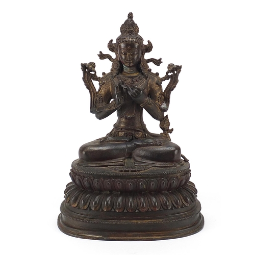 83 - Chino Tibetan patinated bronze figure of seated Buddha, 35cm high