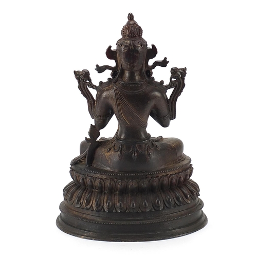 83 - Chino Tibetan patinated bronze figure of seated Buddha, 35cm high