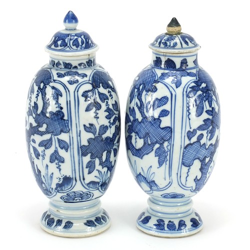 125 - Matched pair of Chinese blue and white porcelain vases and covers hand painted with panels of flower... 