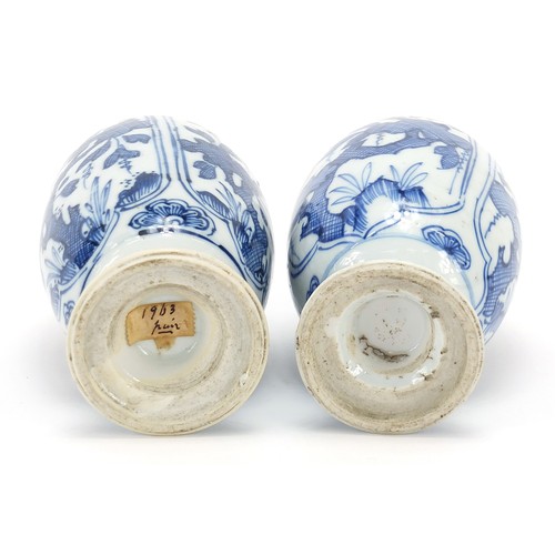 125 - Matched pair of Chinese blue and white porcelain vases and covers hand painted with panels of flower... 