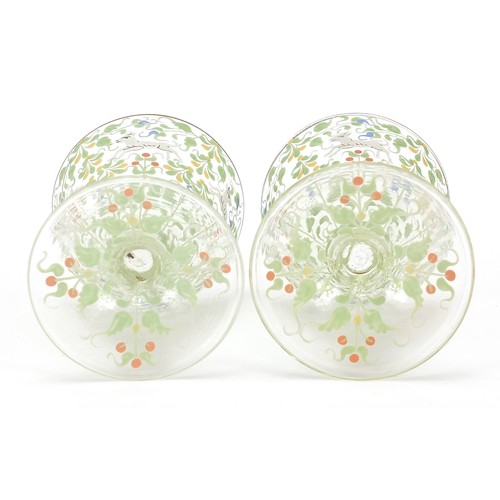 99 - Pair of Bohemian cocktail glasses in the manner of Moser, each enamelled with wild animals amongst f... 