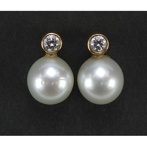 859 - Pair of 18ct gold pearl and diamond stud earrings, 1.3cm high, 3.4g