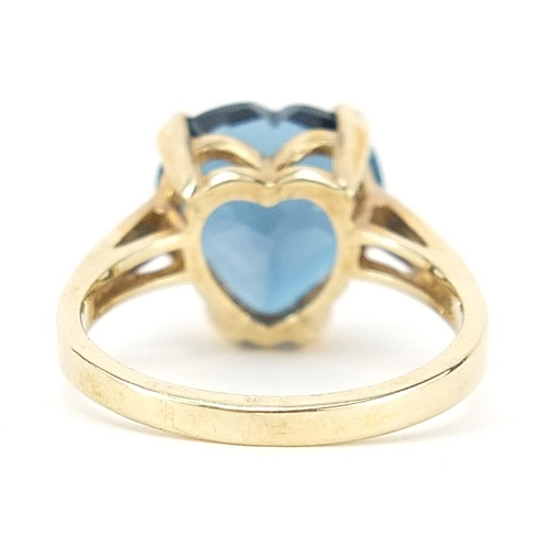 185 - 9ct gold blue topaz love heart ring, size R, 5.4g