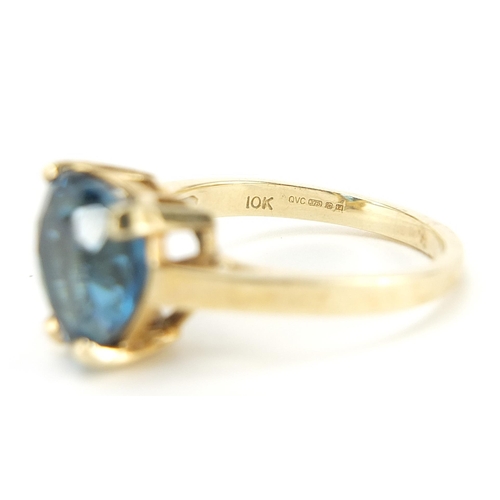 185 - 9ct gold blue topaz love heart ring, size R, 5.4g