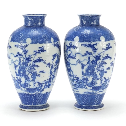 14 - Pair of Japanese blue and white porcelain vases, each decorated with scholars in a landscape, charac... 