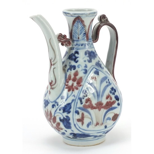 1053 - Chinese blue and white with iron red porcelain wine ewer hand painted with flowers, 19.5cm high