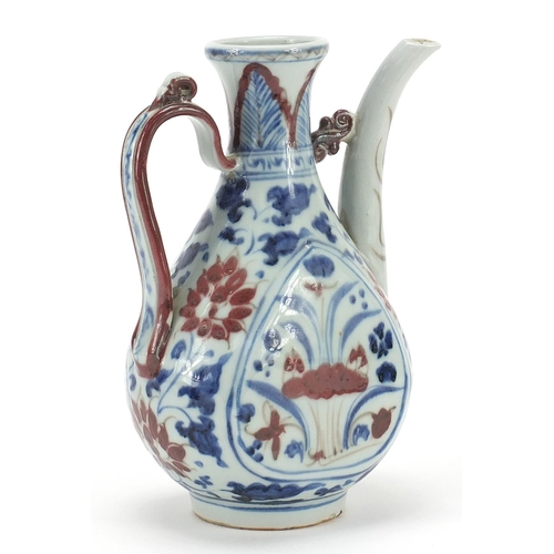 1053 - Chinese blue and white with iron red porcelain wine ewer hand painted with flowers, 19.5cm high