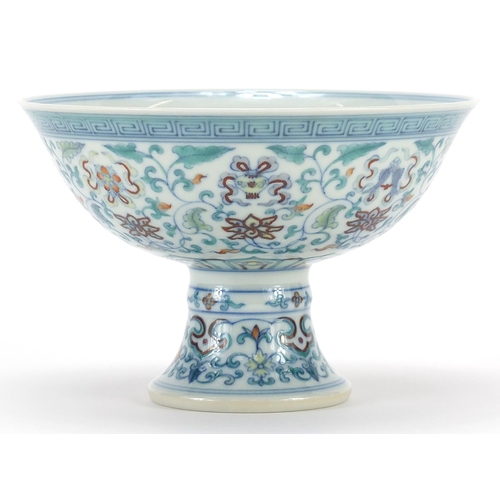 924 - Chinese doucai porcelain stem bowl hand painted with flowers and Daoist emblems, six figure characte... 