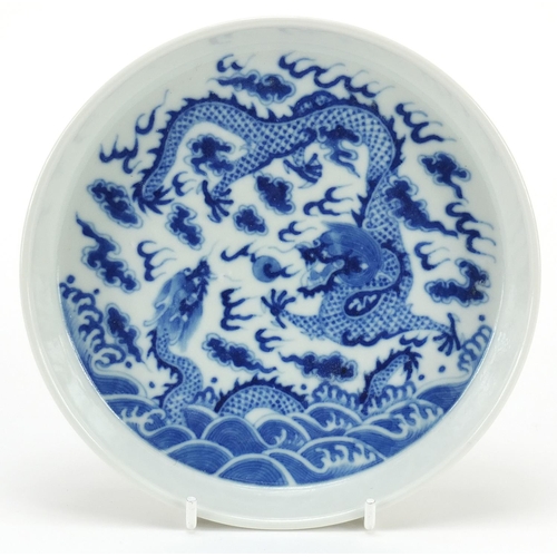 928 - Chinese blue and white porcelain dish hand painted with dragons chasing a flaming pearl amongst clou... 