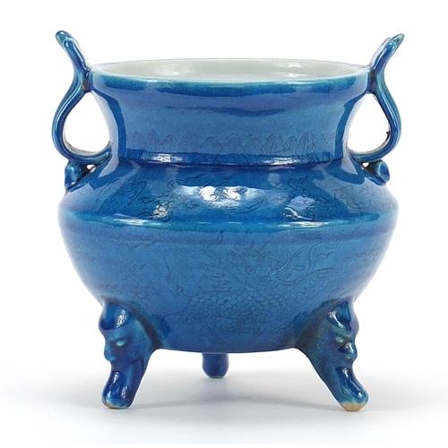 895 - Chinese blue glazed porcelain tripod censer with twin handles incised with mythical animals, six fig... 