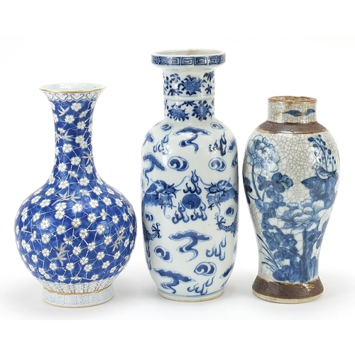 977 - Three Chinese porcelain vases including a Rouleau vase hand painted with a dragon, the largest 23cm ... 