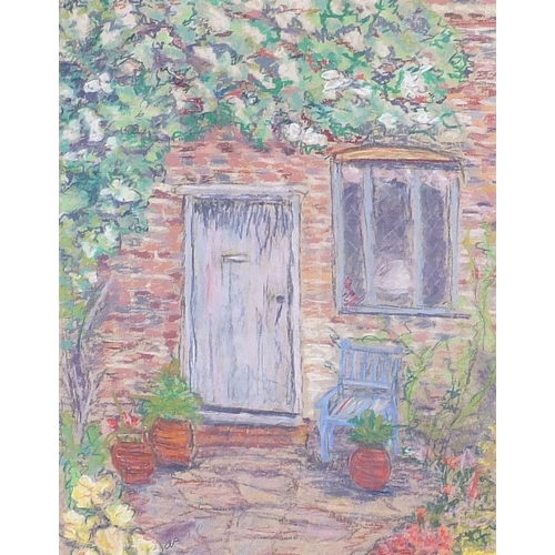 287 - Cottage garden with flowers, pastel, mounted, framed and glazed, 35cm x 27.5cm excluding the mount a... 