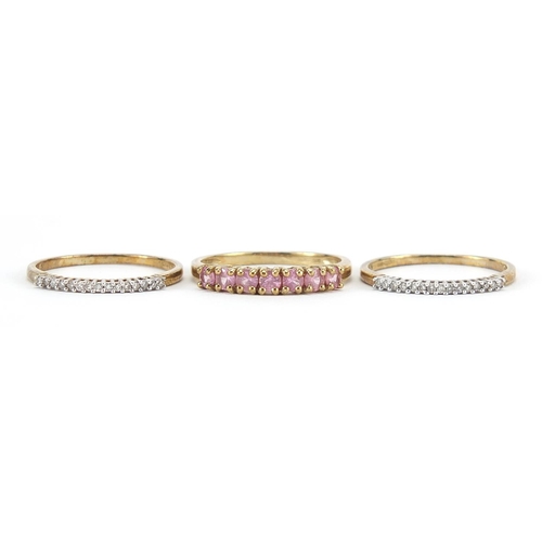 170 - Three 9ct gold half eternity rings set with diamonds and pink stones, sizes N/O, 3.9g