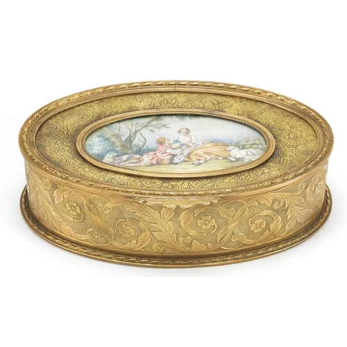 881 - French gilt brass jewel casket engraved with flowers having a hinged lid inset with an oval plaque h... 