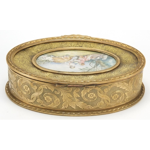 881 - French gilt brass jewel casket engraved with flowers having a hinged lid inset with an oval plaque h... 