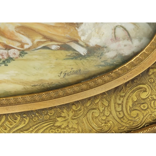 881 - French gilt brass jewel casket engraved with flowers having a hinged lid inset with an oval plaque h... 