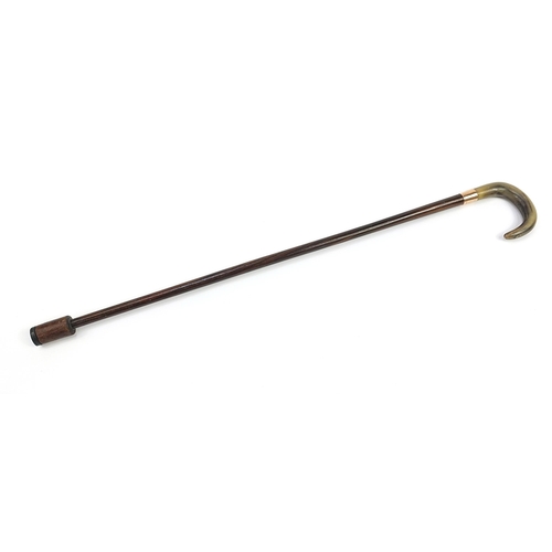 945 - Rosewood walking stick with horn handle and 9ct gold collar impressed Kendall, 86cm in length