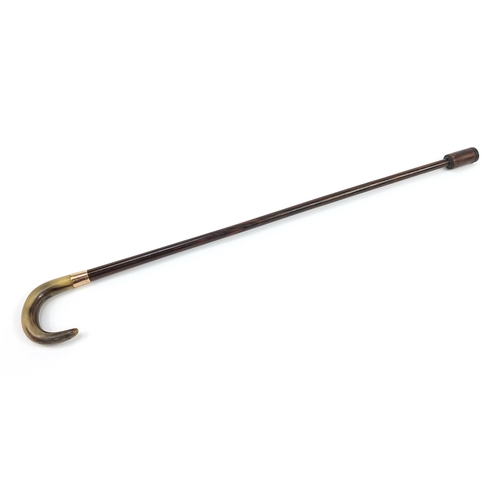 945 - Rosewood walking stick with horn handle and 9ct gold collar impressed Kendall, 86cm in length