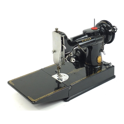 1008 - Victorian black enamel sewing machine with carry case, model 221K, the case 36cm wide