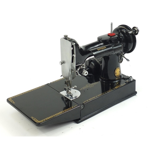 1007 - Victorian black enamel sewing machine with carry case, model 221K, the case 36cm wide