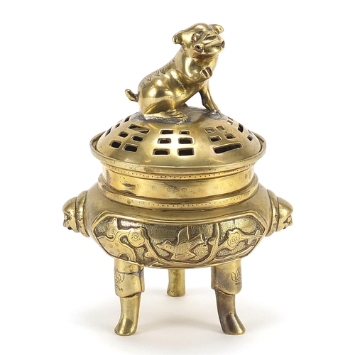 937 - Chinese bronze three footed koro and cover with Foo dog knop, character marks to the base, 22cm high