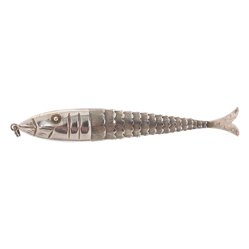 96 - Silver coloured metal articulated fish pendant marked 925 to the suspension loop, 11cm in length, 9.... 