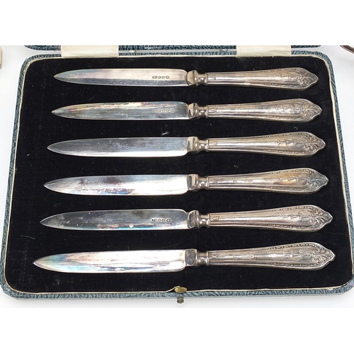 97 - Silver items including cruets, ring tree and set of six silver handled butter knives with steel blad... 