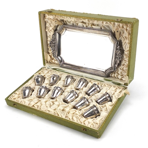 99 - Continental set of twelve silver plated liqueur cups with tray housed in a fitted silk lined box, re... 