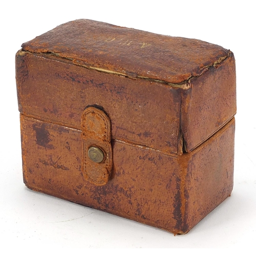 876 - Three 19th century cut glass bottles with brass lids housed in a fitted leather travelling case, ove... 