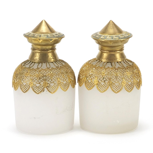 882 - Pair of continental opaline glass scent bottles with gilt metal mounts and stoppers, each 10cm high